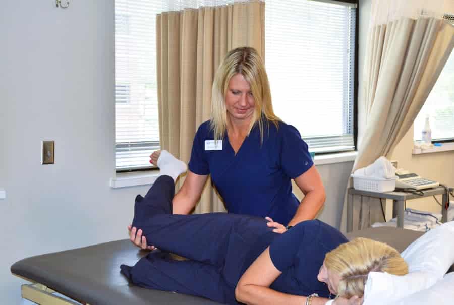 Physical therapist adjusting patient after an epidural steroid injection