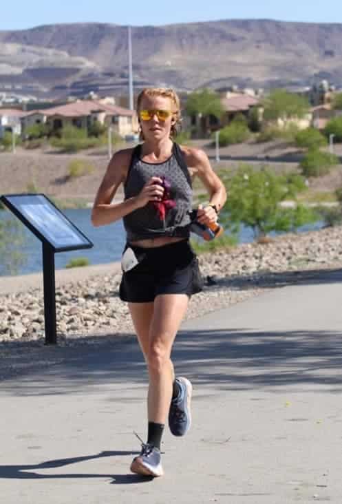 Woman jogging on paved pathway