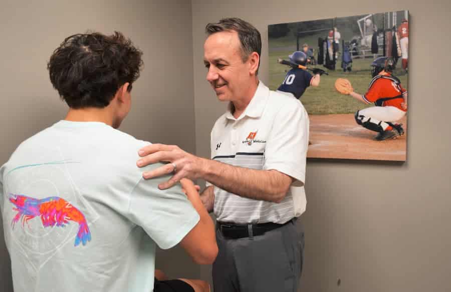 Dr Michael Ellerbusch examining patient for labral tear