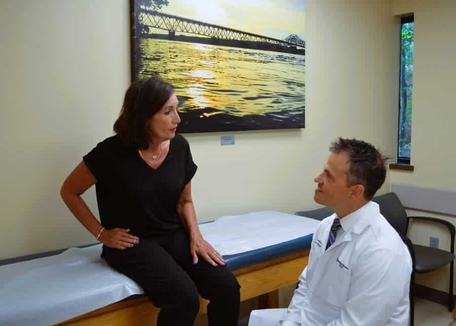 Dr. Ryan Cordry examining patient hip